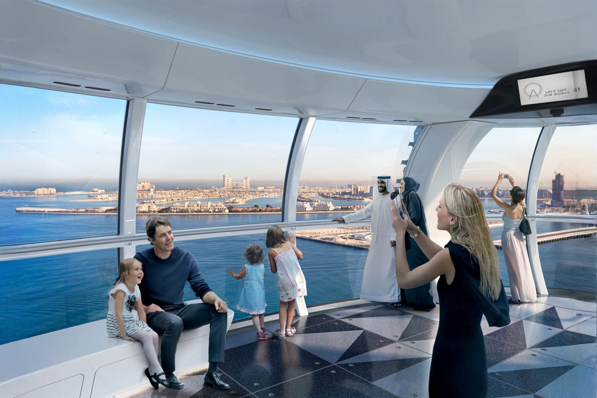 Ain Dubai observation wheel with white central pillar and cable supports overlooking Dubai coastline and turquoise water (4)